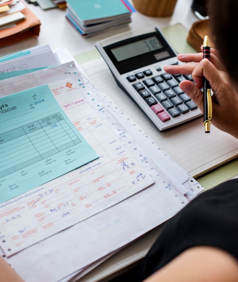 Asian woman working through paperwork